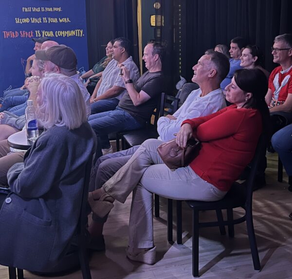 Audience members laughing at Third Space Improv