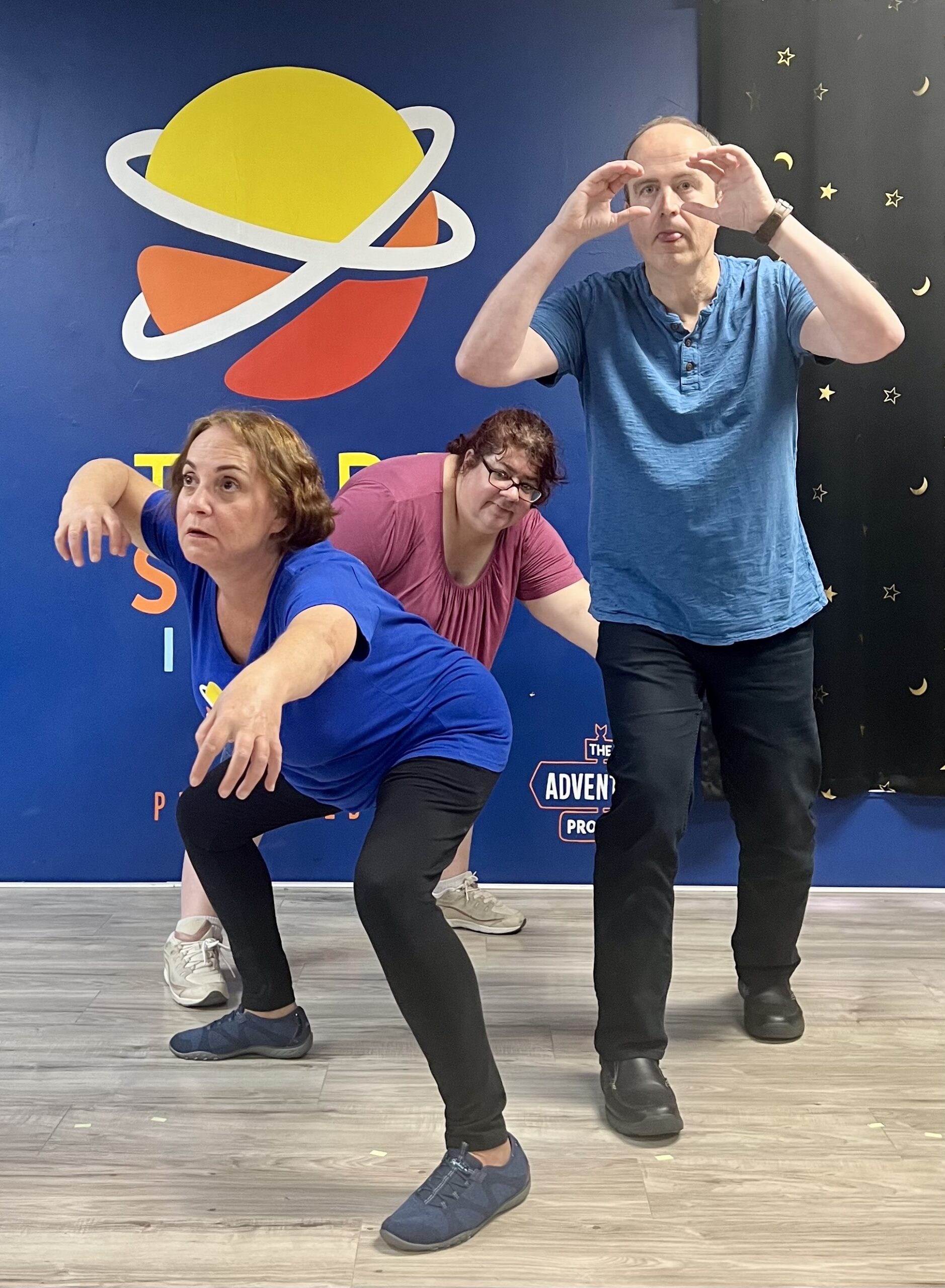 Adults playing at Third Space Improv's monthly Improv Jam